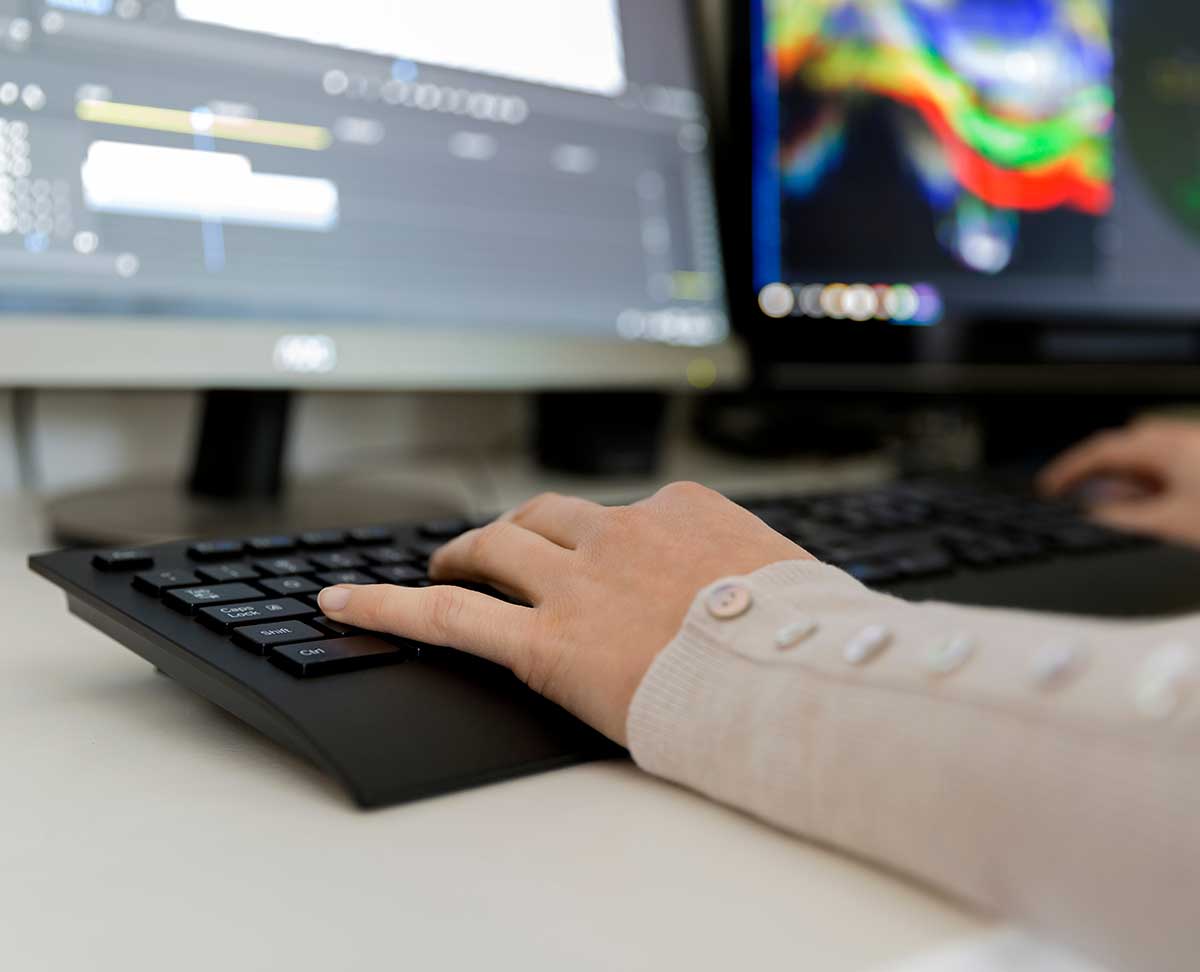 Person typing on keyboard